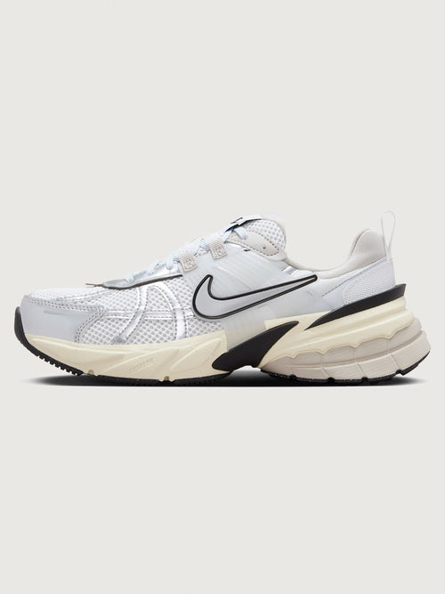 Gray and black sneaker with Nike logo on a white background