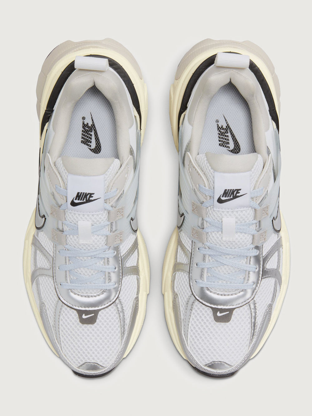 Gray and black sneaker with Nike logo on a white background