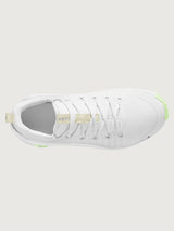 White athletic shoe with neon green sole.