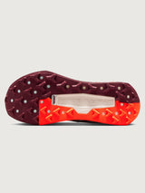 White running shoe with orange swoosh logo on a light gray background