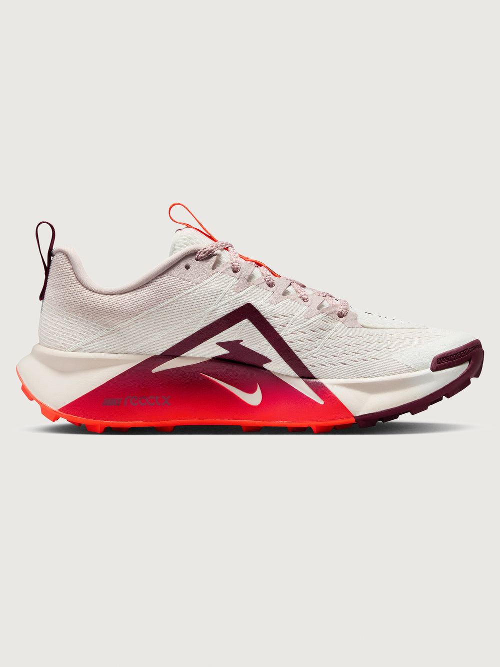 White running shoe with orange swoosh logo on a light gray background