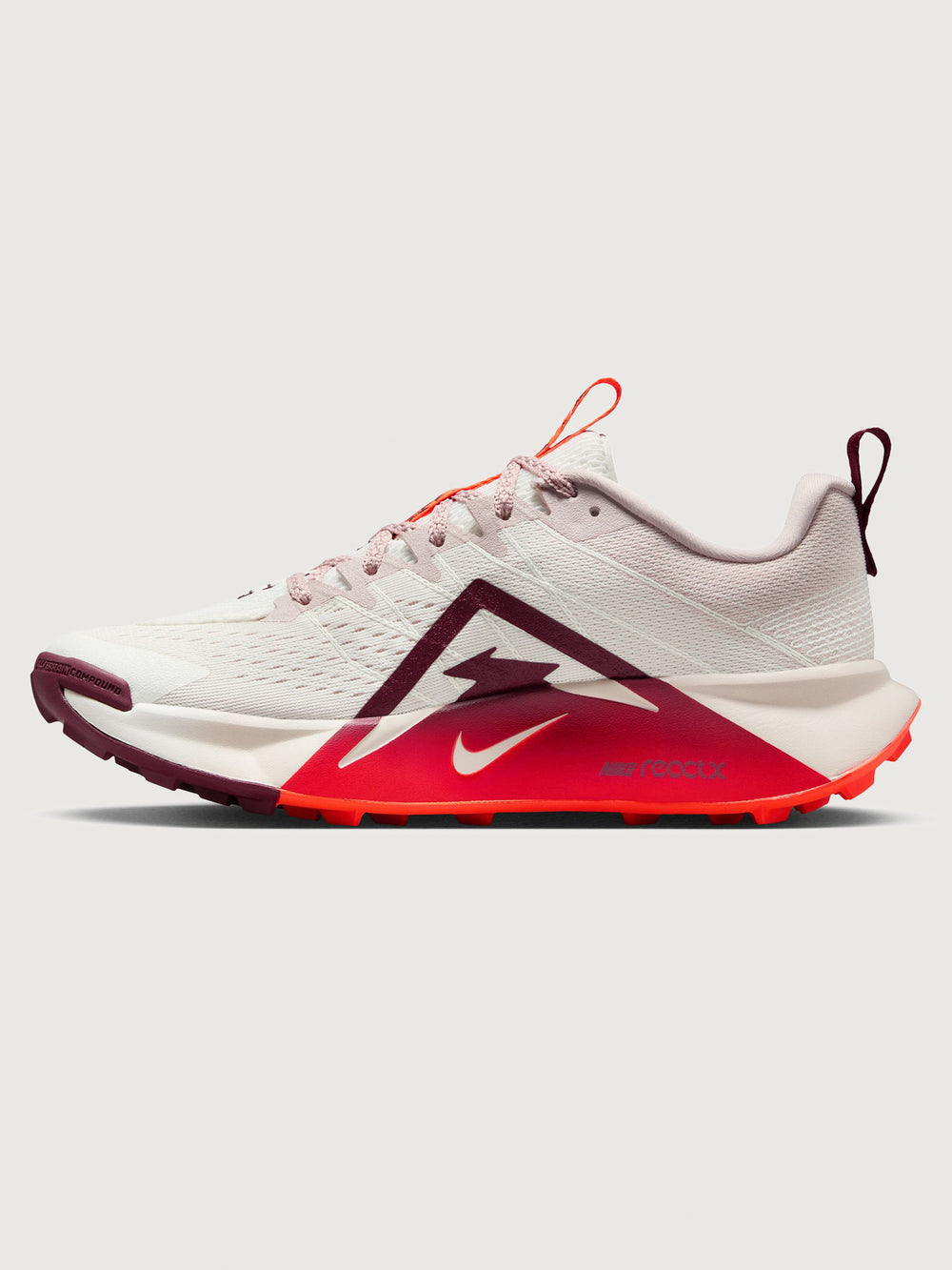 White running shoe with orange swoosh logo on a light gray background
