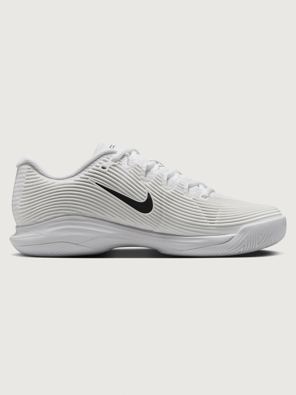 White athletic shoe with black swoosh logo on a white background