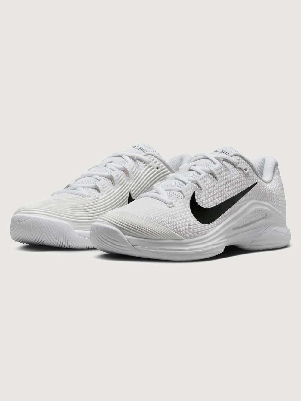 White athletic shoe with black swoosh logo on a white background