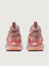 Pink and white sneaker with Nike logo.