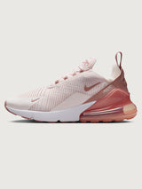 Pink and white sneaker with Nike logo.