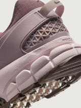 Nike Zoom Vomero Roam in Tattoo and Particle Rose, heel cushioning close-up.