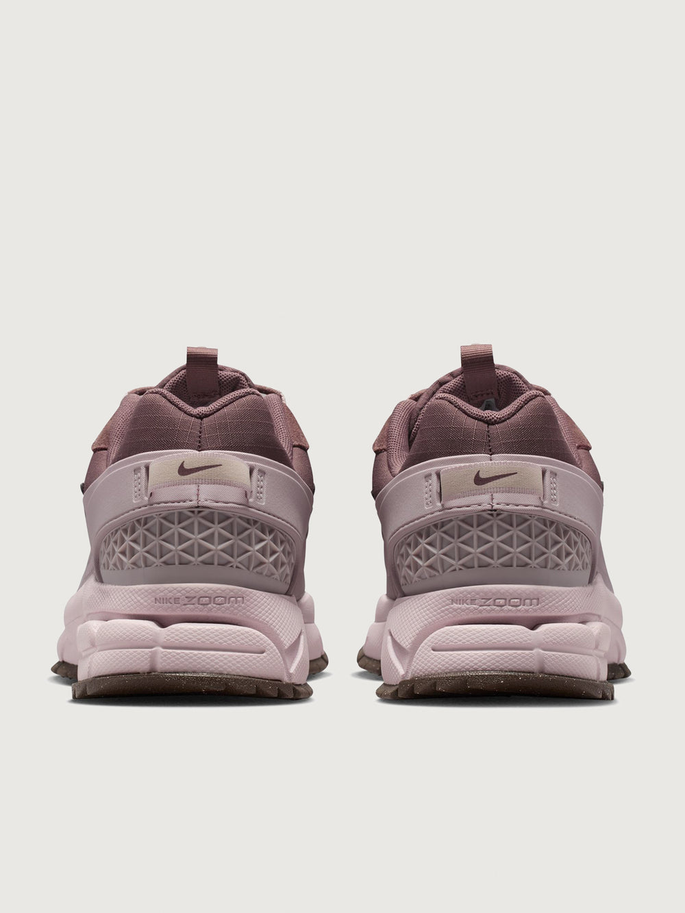 Nike Zoom Vomero Roam in Tattoo and Particle Rose, back heel view.