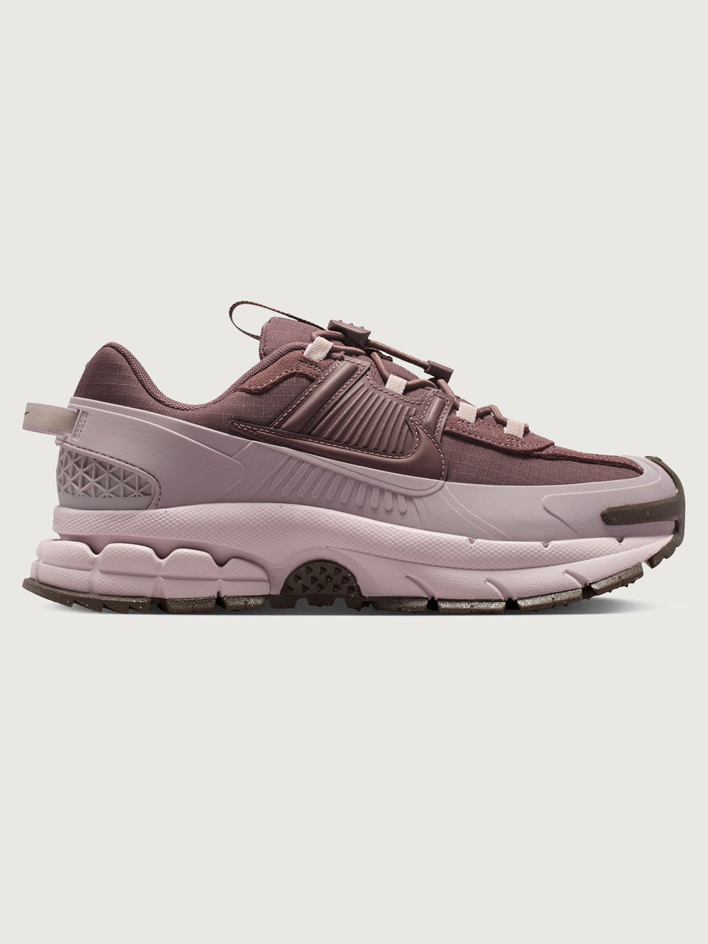 Nike Zoom Vomero Roam in Tattoo and Particle Rose, side profile view.