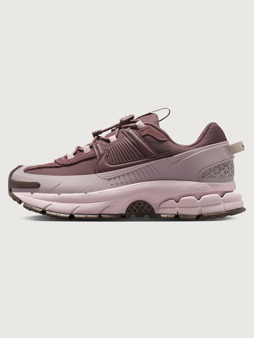 Nike Zoom Vomero Roam in Tattoo and Particle Rose, lateral side view.