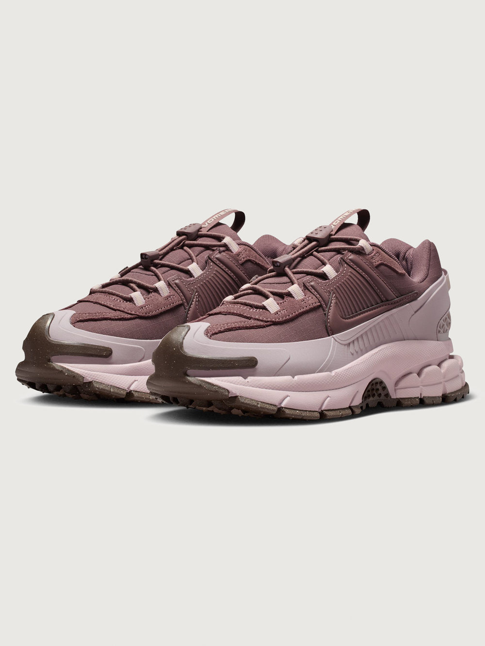 Nike Zoom Vomero Roam in Tattoo and Particle Rose, paired shoes front view.