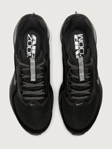 Black running shoes with 'Air Zoom' branding on a white background