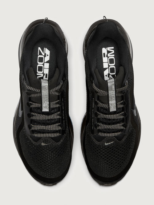 Black running shoes with 'Air Zoom' branding on a white background