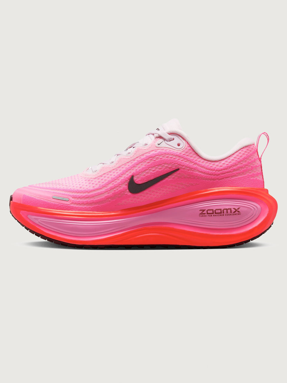 Pink running shoe with black Nike logo on a white background