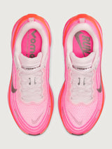Pink running shoe with black Nike logo on a white background