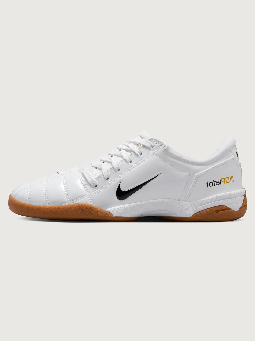 White Nike sneaker with brown sole on a white background