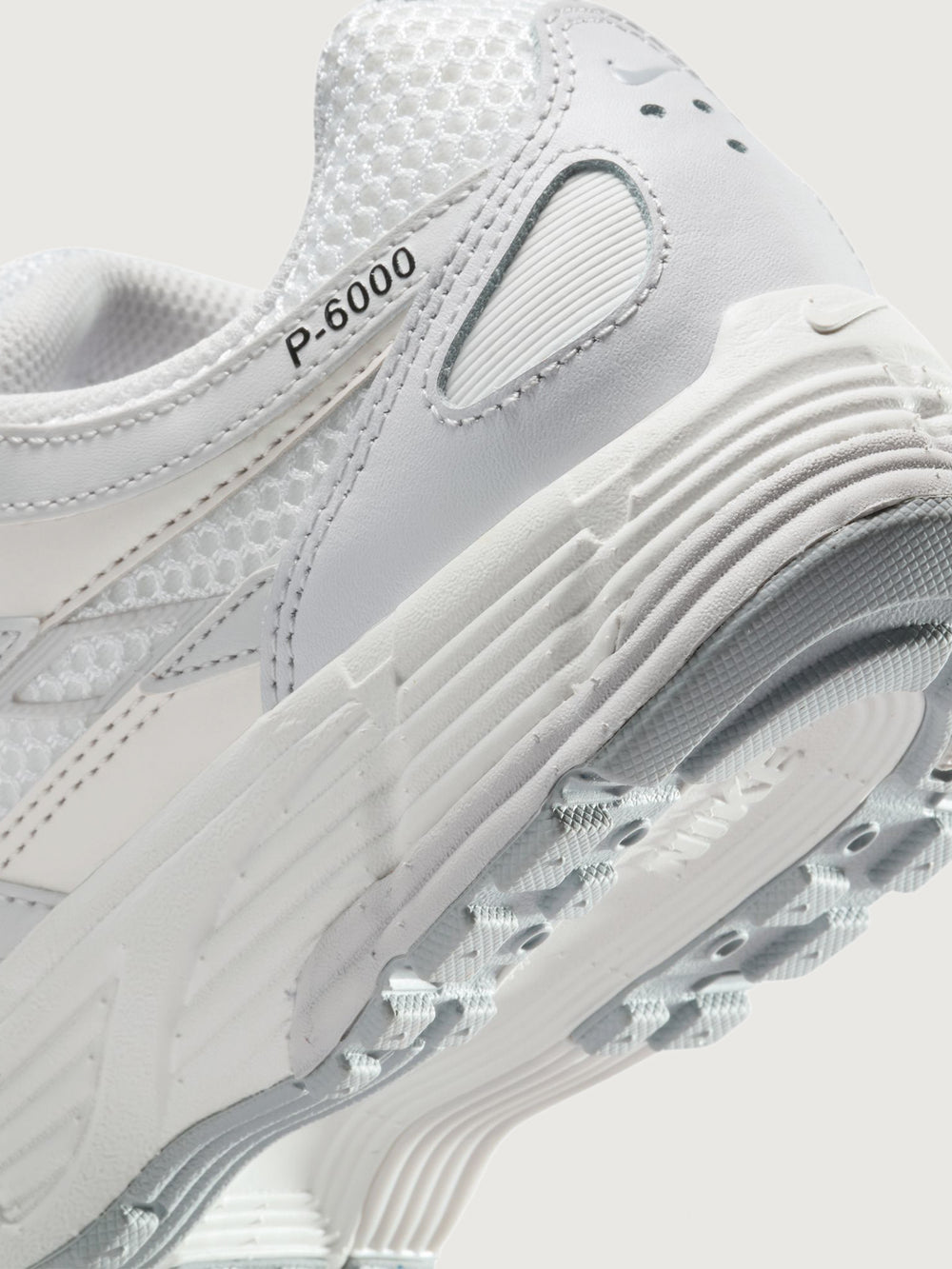 Nike P-6000 SE in Summit White and Wolf Grey, close-up heel and outsole detail.