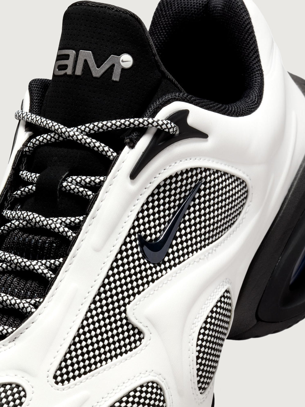 Air Max Muse 2 in Summit White/Metallic Dark Grey/Black, close-up view of mesh panel and swoosh detail.