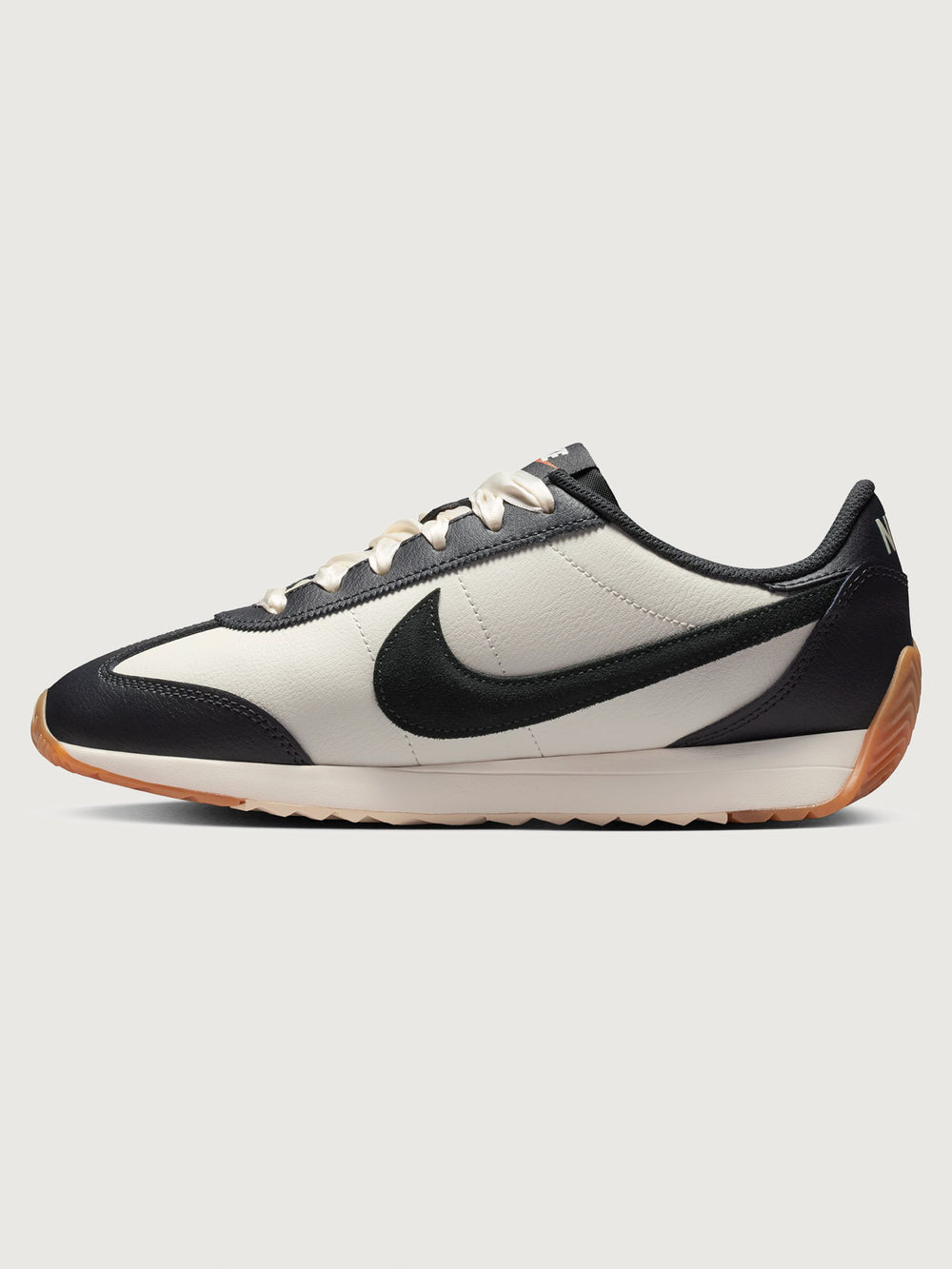 Women’s Pacific Leather trainer in Sail and Off Noir, side view.