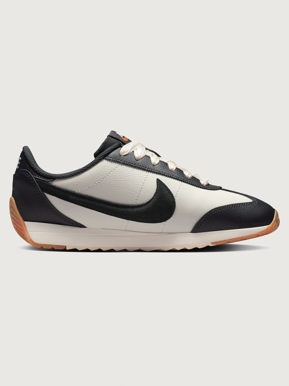 Women’s Pacific Leather trainer in Sail and Off Noir, side view.