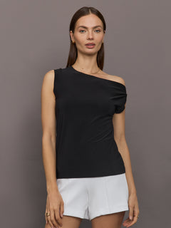 Model wears black short-sleeve top with a drop shoulder design.




