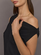 Model wears black short-sleeve top with a drop shoulder design.
