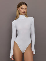 Front view of model wearing Long Sleeve Turtle Bodysuit Snow White with mock neck and fitted silhouette.