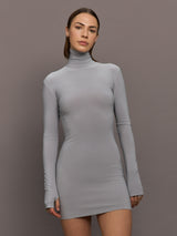 Model is wearing Long Sleeve Turtleneck Mini Dress in Grey, front view highlighting slim fit and high neckline.