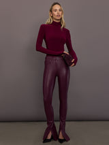 Model is wearing the Spat Jeans in Plum, full body styled look.
