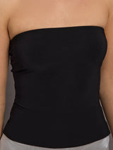 Model is wearing Strapless Contour Top in Black, close-up view showing smooth fabric texture and neckline.