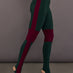 Model is wearing Side Stripe Legging With Knee Patch in Dark Emerald and Plum, side view with pointed toe and stripe detail.