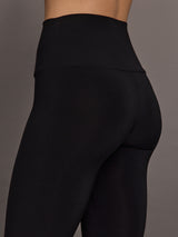 Model is wearing Pedal Pusher in Black, close-up hip and fabric detail.