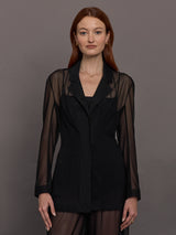 Model wears black single-breasted mesh jacket with a collared neck and tailored fit.




