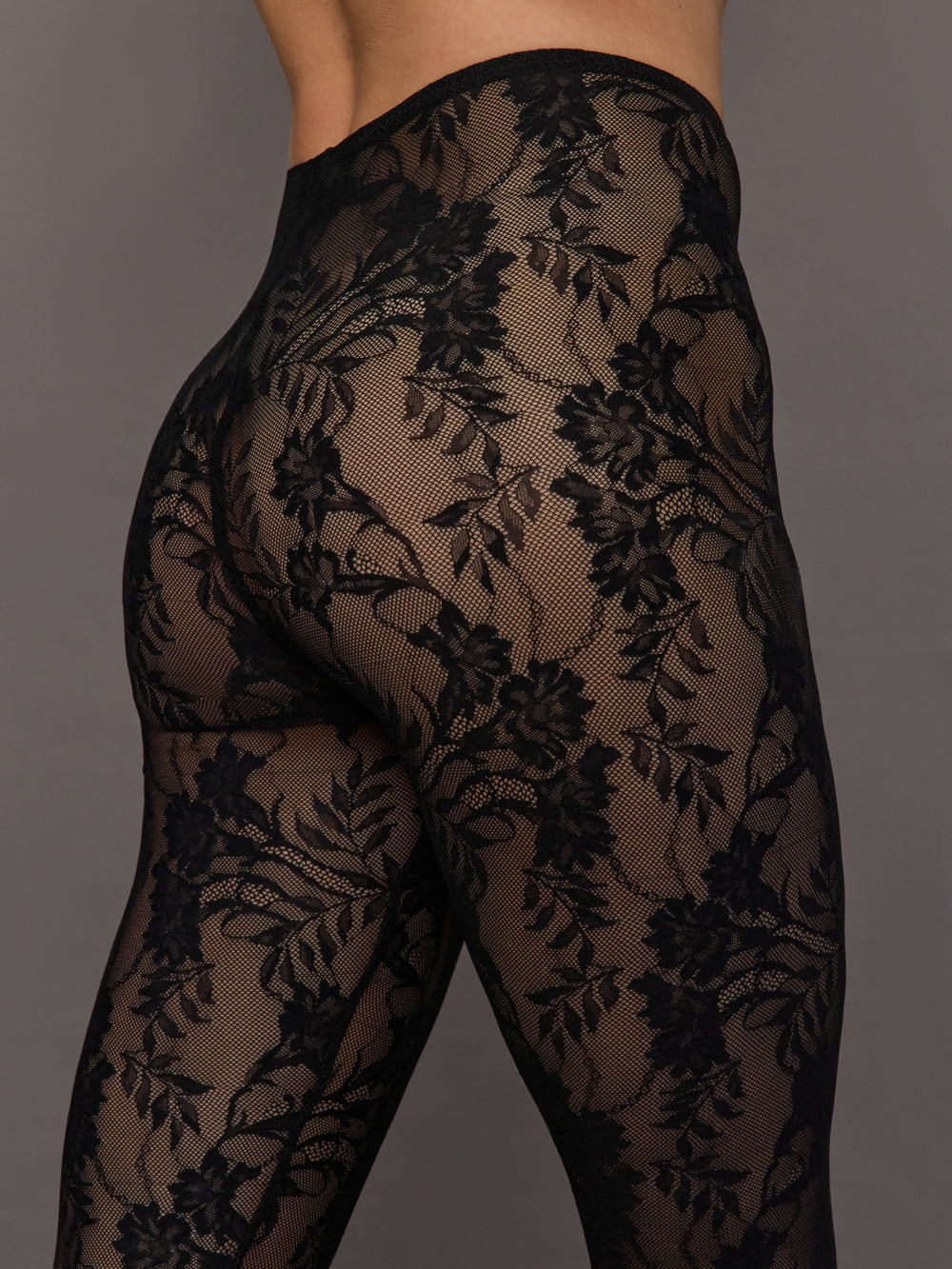 Black lace tights on a gray background
