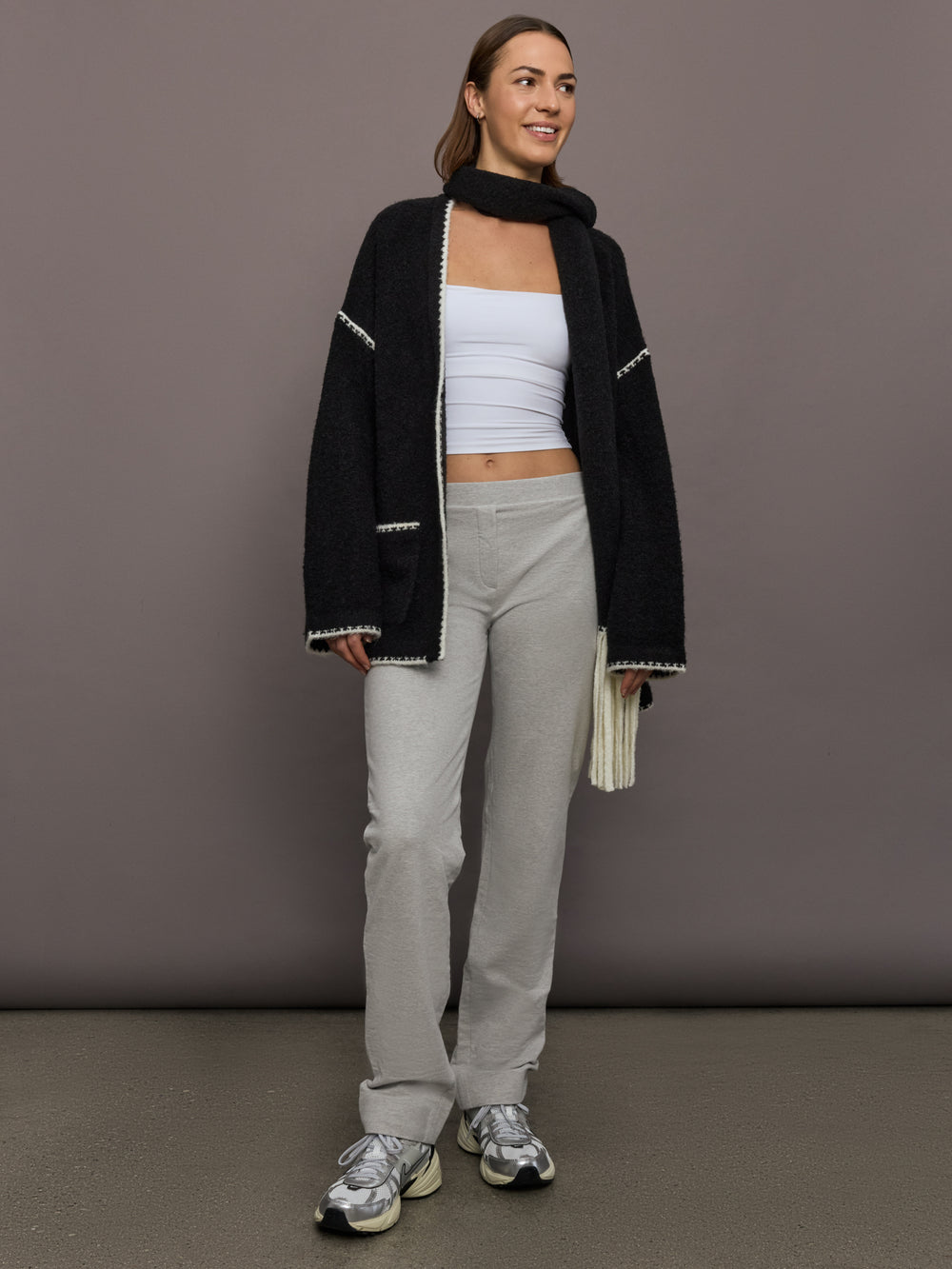 Model is wearing Flat Front Mens Pant in Light Heather Grey, full body view.
