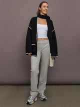 Model is wearing Flat Front Mens Pant in Light Heather Grey, full body view.