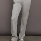 Model is wearing Flat Front Mens Pant in Light Heather Grey, front view.
