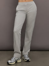 Model is wearing Flat Front Mens Pant in Light Heather Grey, front view.