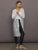 Model styled in Hooded Robe to Knee Clear White with sequin sheer overlay and open front.