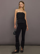 Model styled in Strapless All Over Fringe Top Black with matching fringe hem leggings.