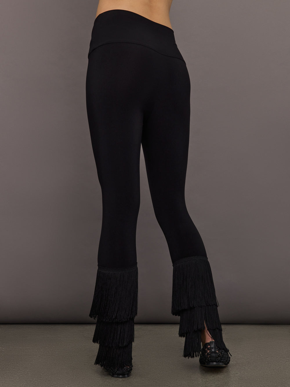Back view of Fringe Hem Cropped Legging Black showing high-rise waistband and fringe hem.