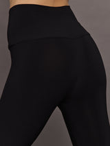 Close-up of Fringe Hem Cropped Legging Black waistband fit.