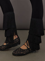 Detailed view of Fringe Hem Cropped Legging Black layered fringe trim at ankle.
