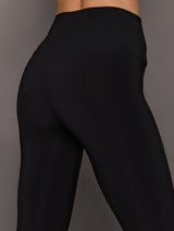 Black leggings on a gray background