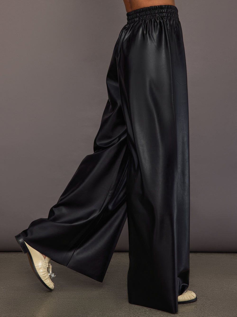Model wearing Black satin wide-leg sweatpants pants