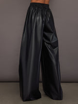 Model wearing Black satin wide-leg sweatpants pants