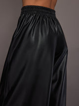 Model wearing Black satin wide-leg sweatpants pants