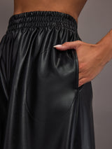 Model wearing Black satin wide-leg sweatpants pants