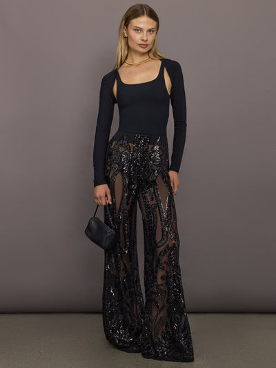 Model styled in Boyfriend Elephant Sweatpant Black with black top and mini bag.