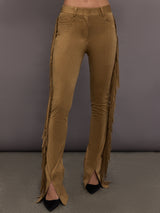 Model is wearing the Fringe Spat Jeans in Camel, front view with center slit detail.
